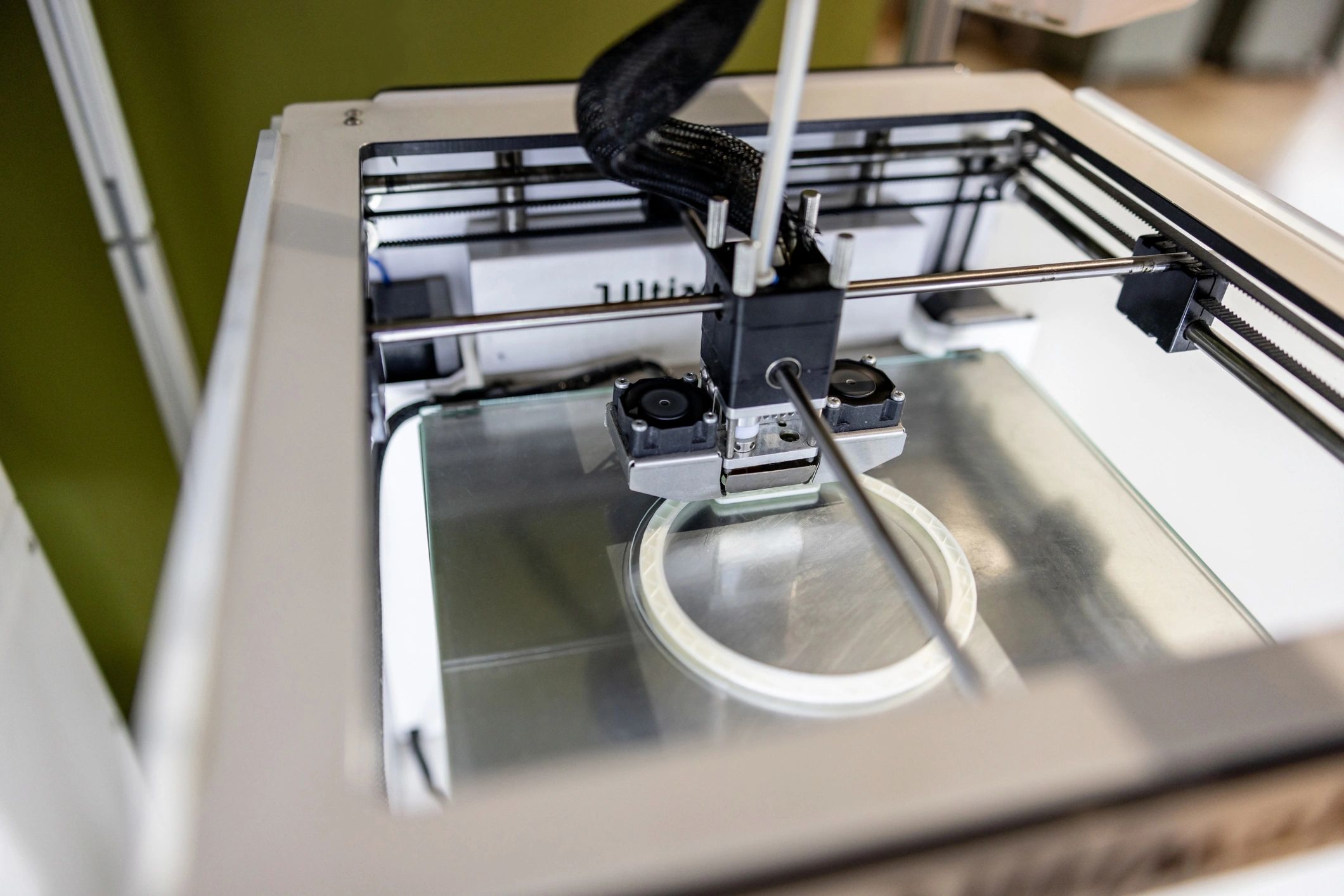 Close-up of a 3D printer printing a model