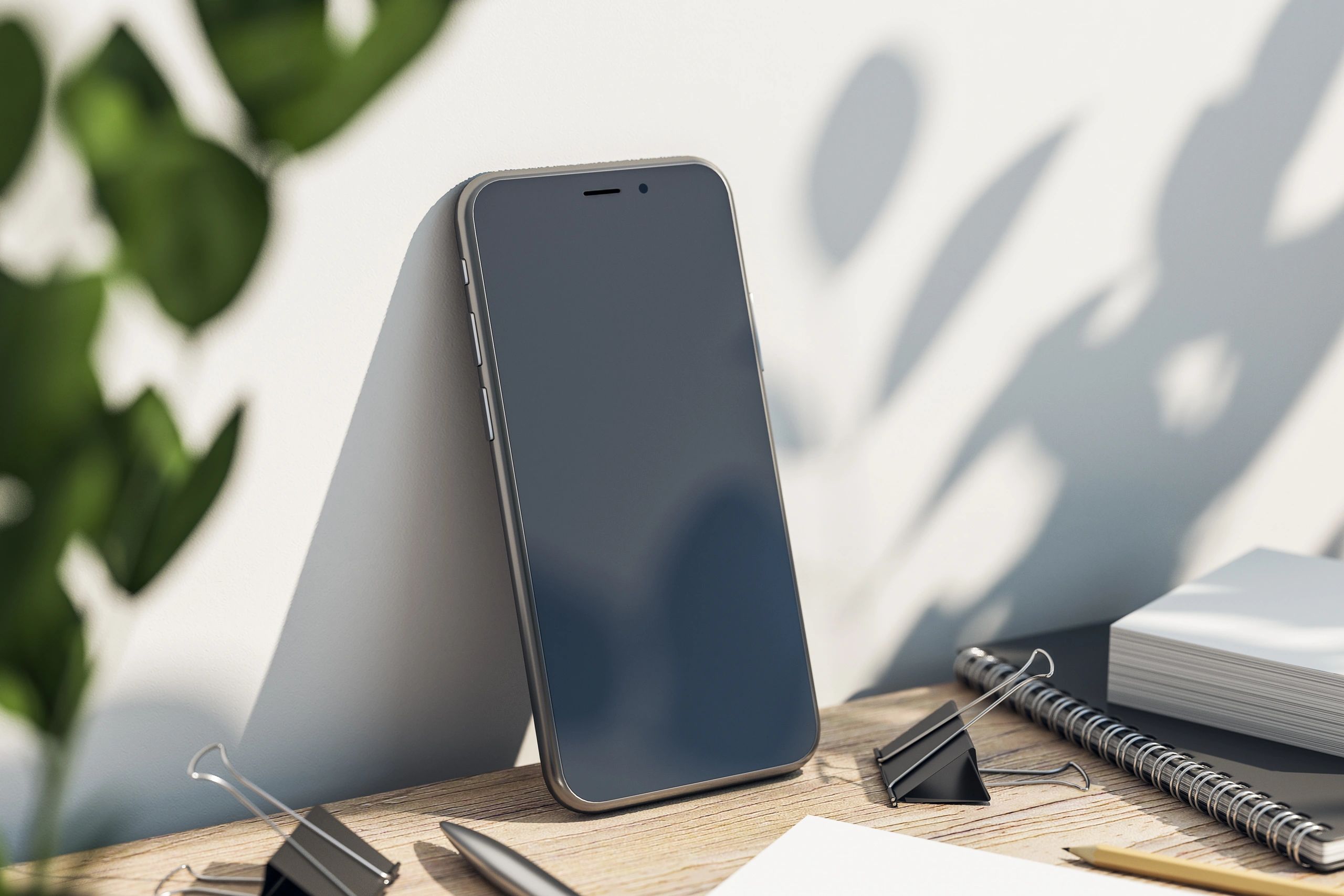 Modern desk setup with smartphone and accessories