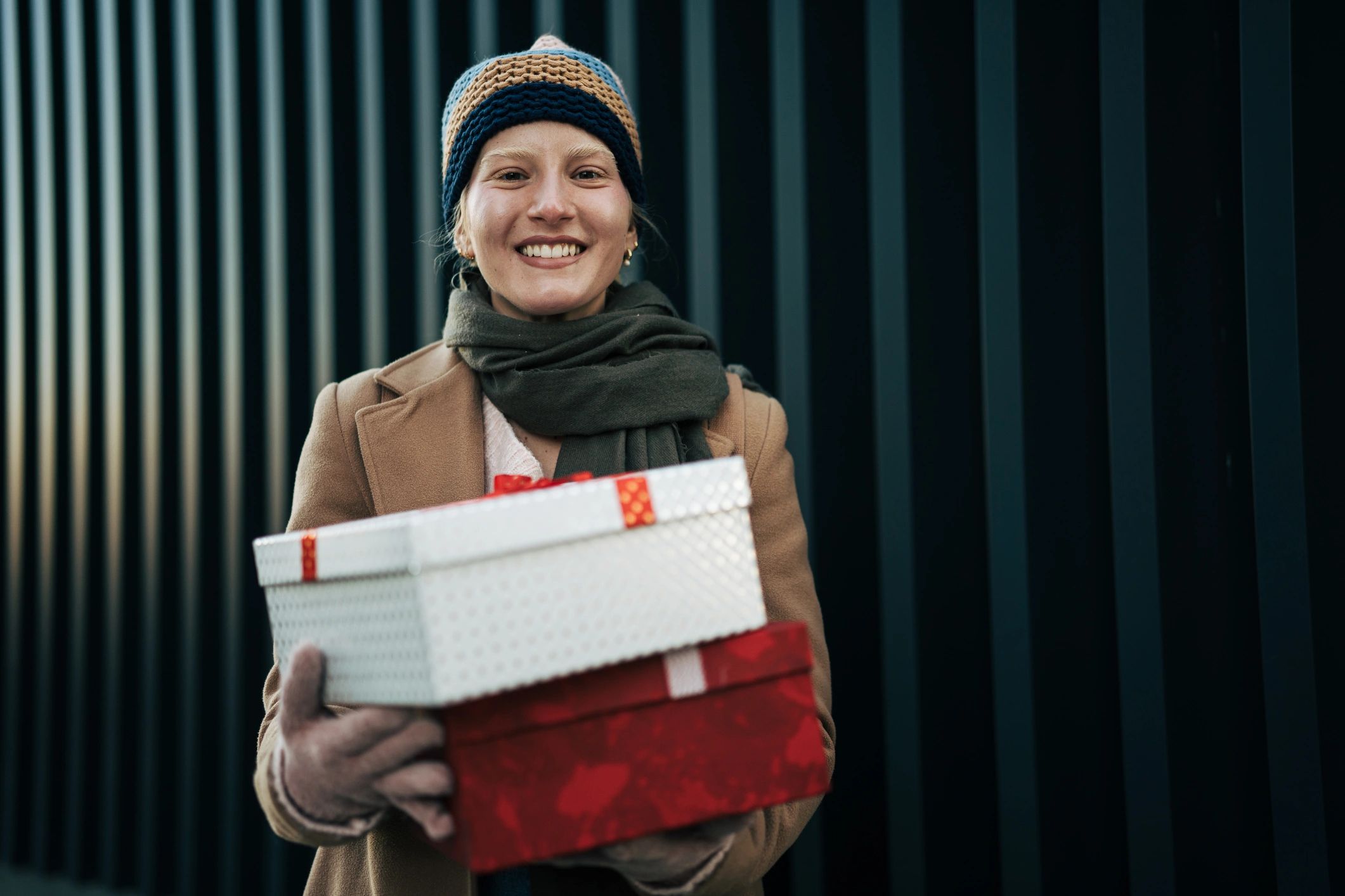 Woman holding wrapped gift boxes